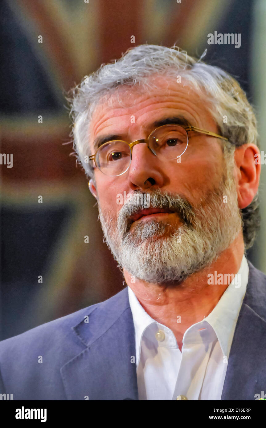 Belfast, Northern Ireland. 24 May 2014 - Sinn Fein President, Gerry Adams (TD for Louth), stands in front of a Union Flag inside Belfast City Hall while he is being interviewed during a live television broadcast Credit:  Stephen Barnes/Alamy Live News Stock Photo