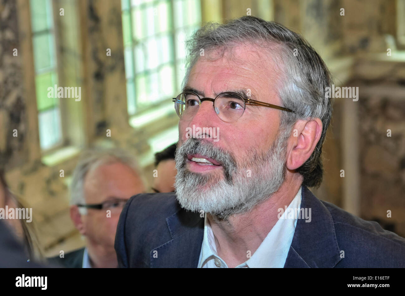 Belfast, Northern Ireland. 24 May 2014 - Sinn Fein President, Gerry Adams (TD for Louth), arrives at Belfast City Hall during the count of the Local Government vote for Belfast City Council.  He was met with huge cheers and applause from supporters. Credit:  Stephen Barnes/Alamy Live News Stock Photo