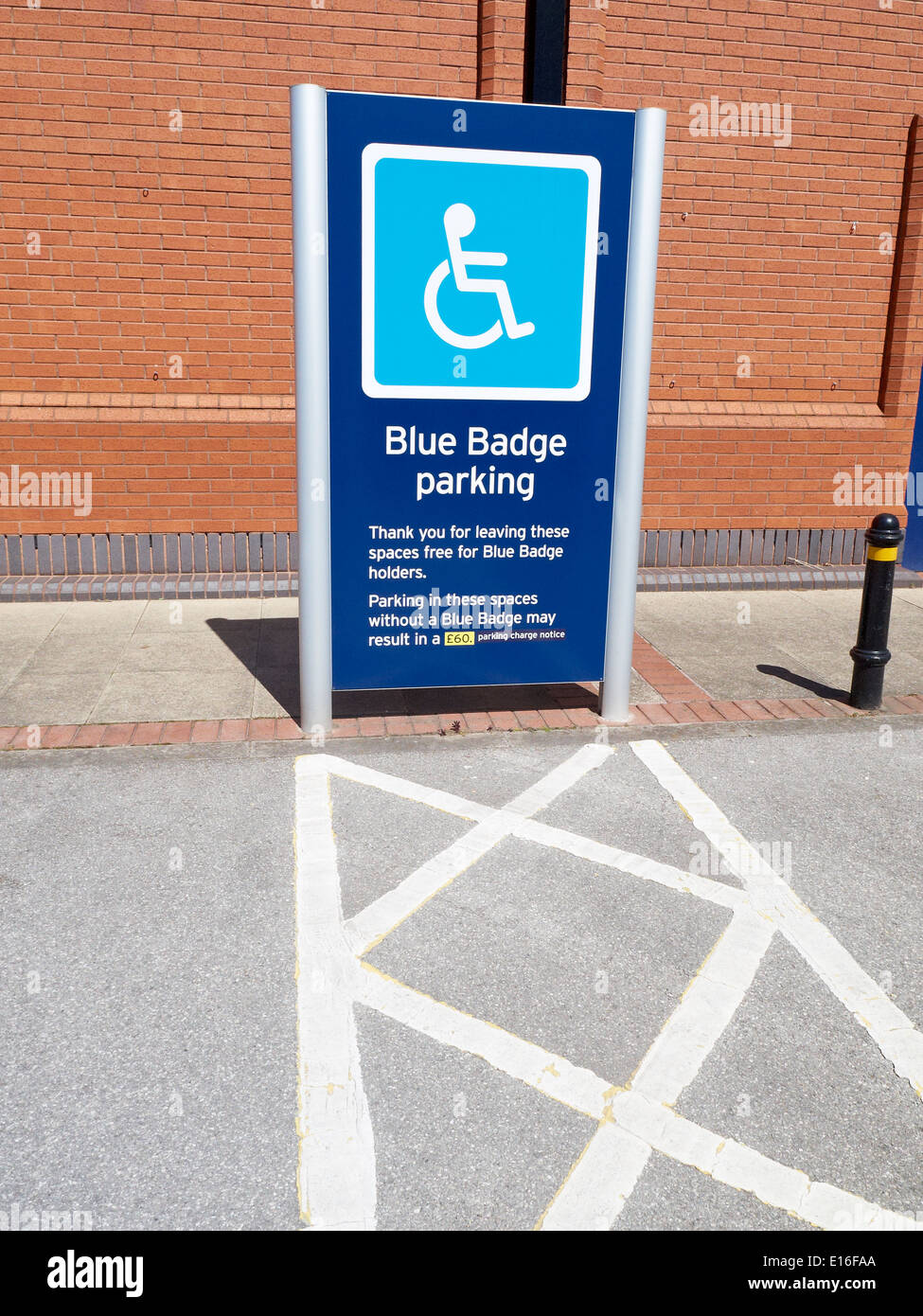 Reserved blue badge parking space sign UK Stock Photo
