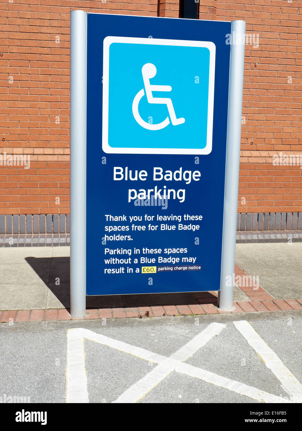 Reserved blue badge parking space sign UK Stock Photo