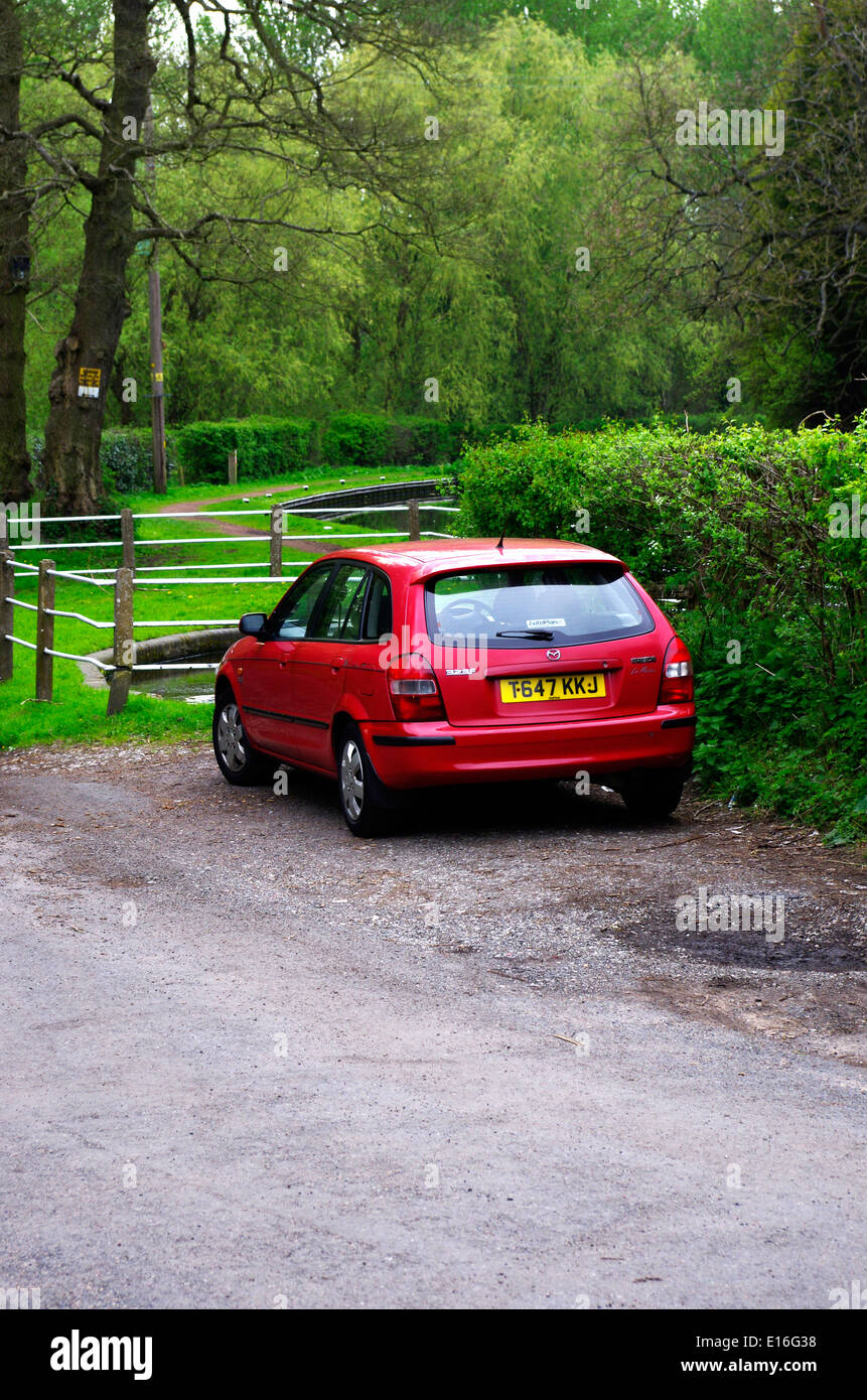 Red Mazda 323f Hatchback Car, UK Stock Photo