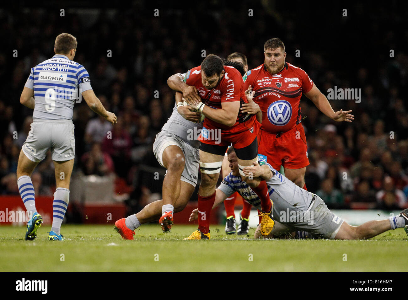 Cardiff, Wales. 24th May, 2014. Danie ROSSOUW of RC Toulon is tackled by Matt STEVENS (left) and Billy VUNIPOLA (left) of Saracens during the Heineken Cup final between RC Toulon and Saracens at Millennium Stadium. Credit:  Action Plus Sports/Alamy Live News Stock Photo