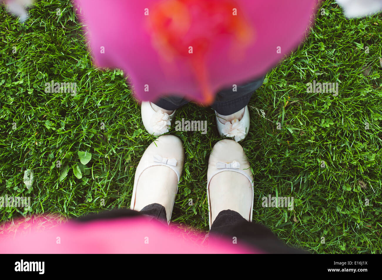 Low section of two girls' feet Stock Photo