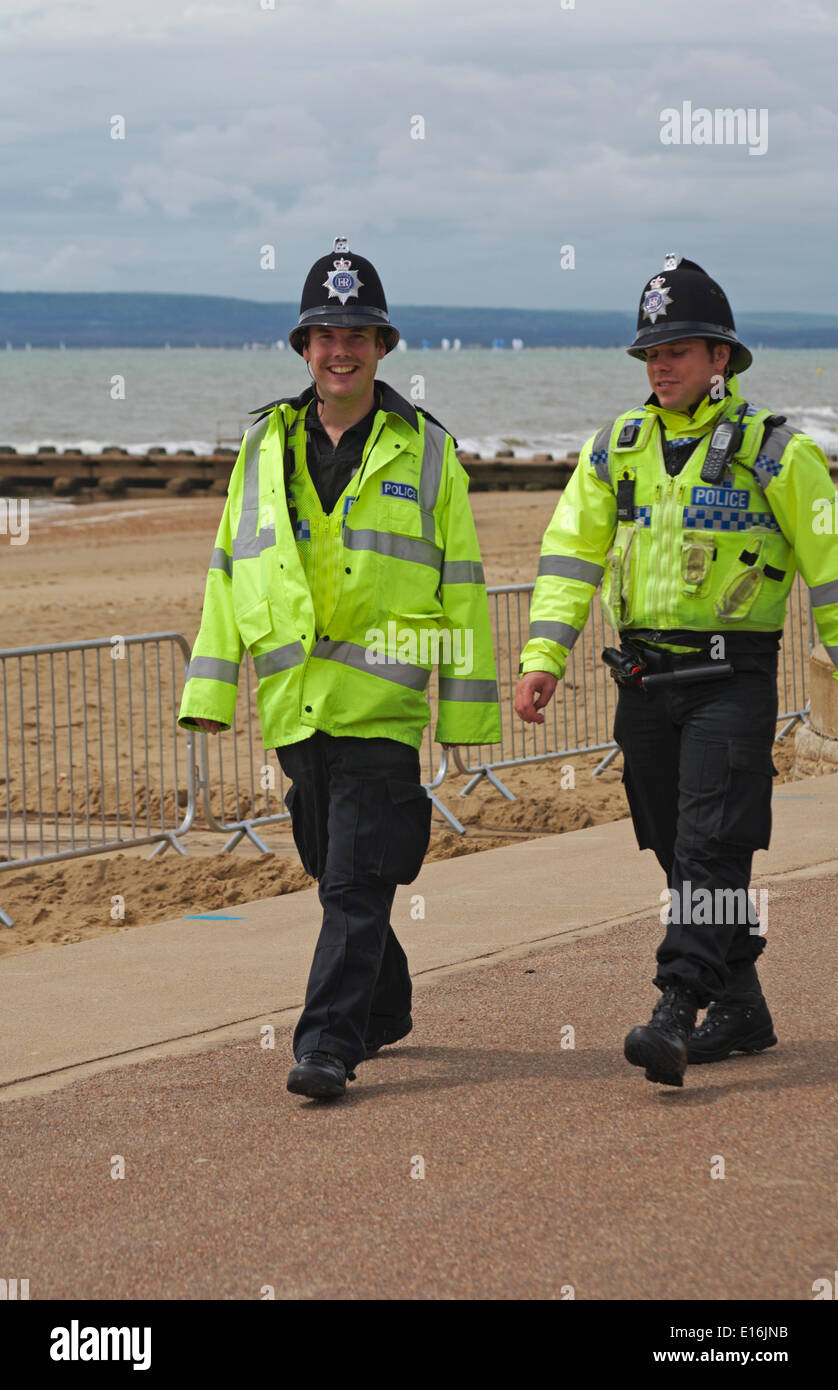 policemen in high visibility jackets walking along Bournemouth promenade on patrol at the first ever Bournemouth Wheels Festival in May Credit:  Carolyn Jenkins/Alamy Live News Stock Photo