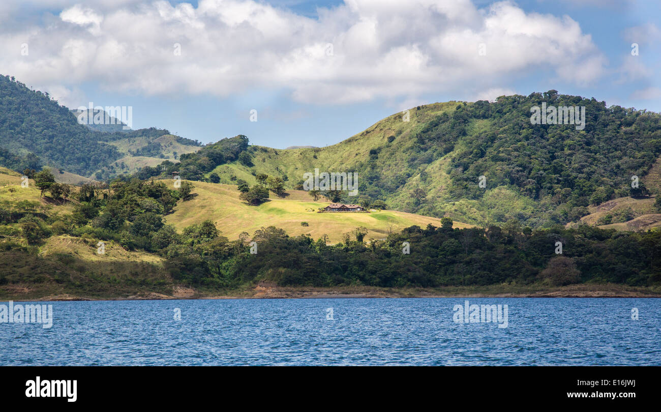 Landscape with ranch on the shores of Arenal lake in central Costa Rica Stock Photo