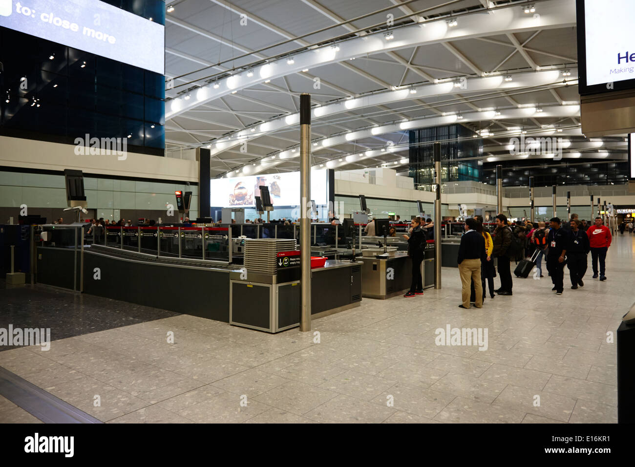 security screening London Heathrow Airport Terminal 5 early in the morning UK Stock Photo
