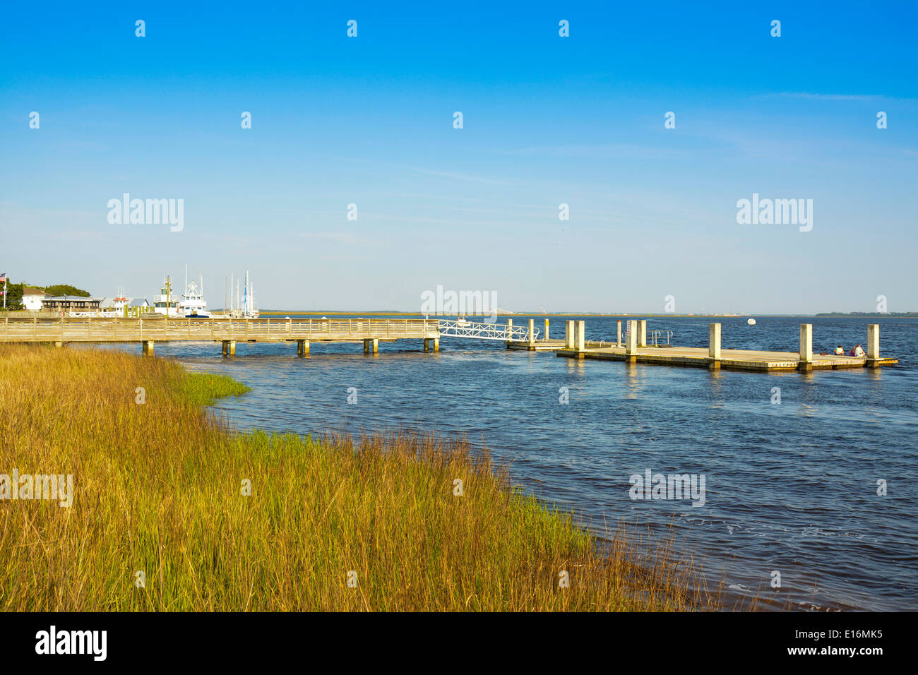 Lowcountry marsh plants frame the wooden piers at the waterfront at St Mary's, GA, USA Stock Photo
