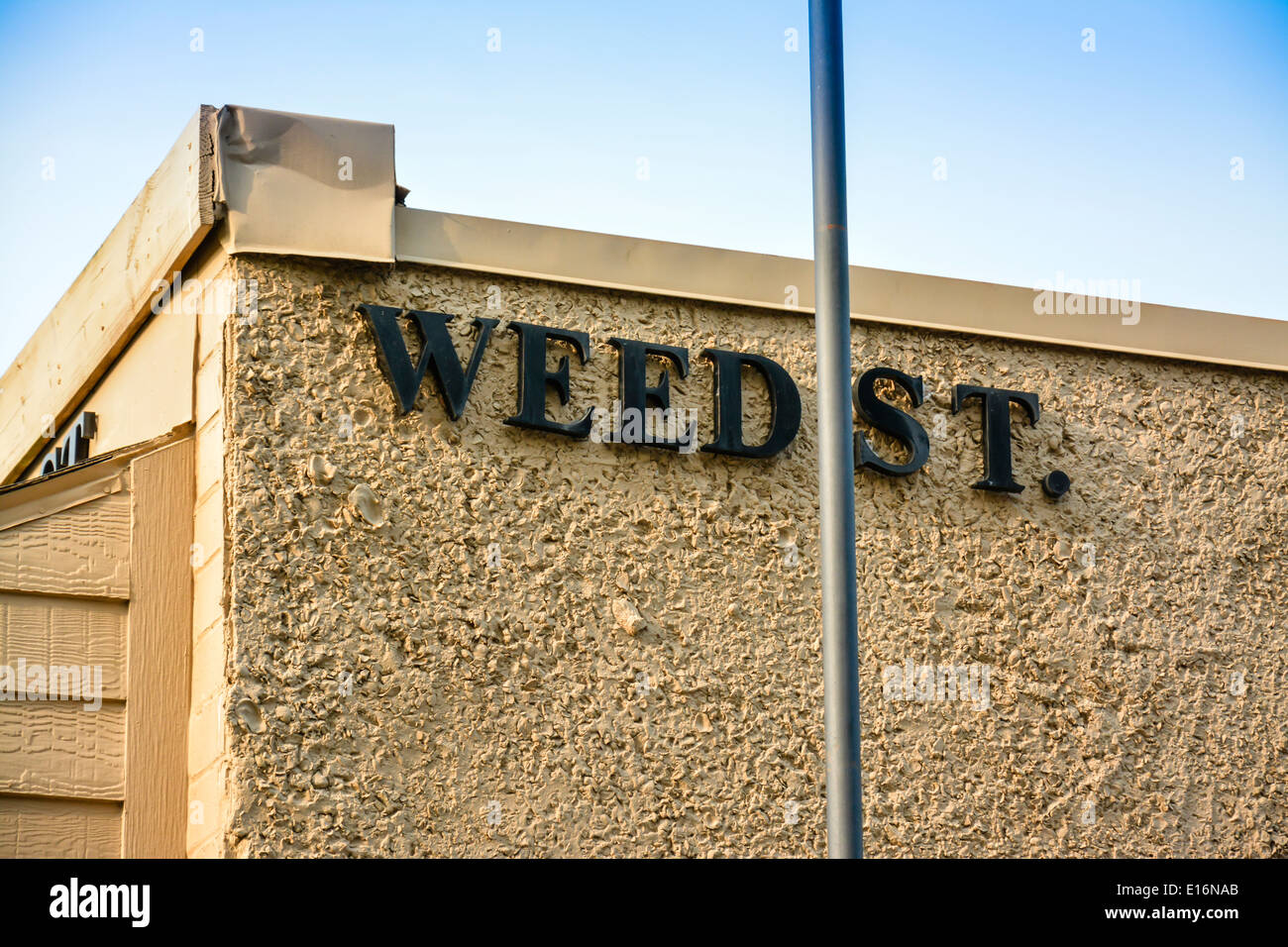 Weed Street lettering on building is a funny double entendre due to the legal access to marijuana expanding all over the USA Stock Photo