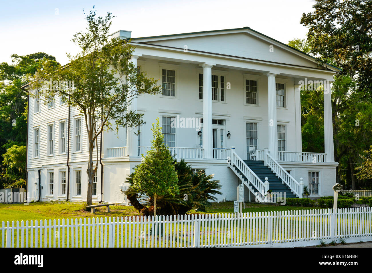 Impressive, large white Greek Revival designed Orange Hall building built in 1830 sits dramatically in historic St.Mary's, GA, USA Stock Photo