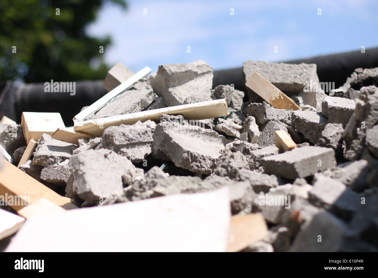 Construction site after demolished garage with a pile of broken cinder