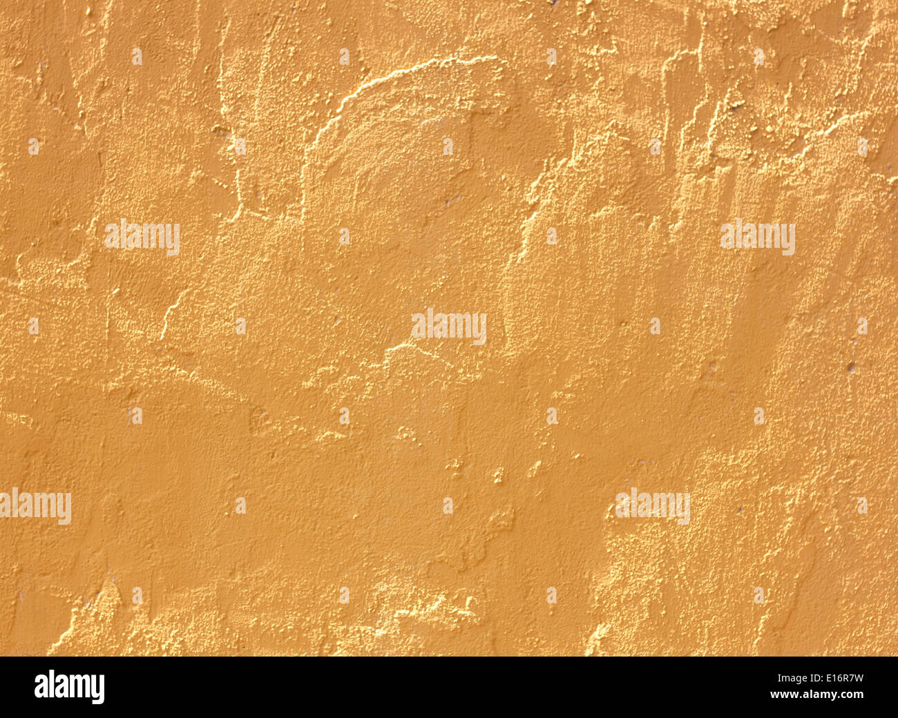 Yellow cement wall abstract background plaster construction. Stock Photo