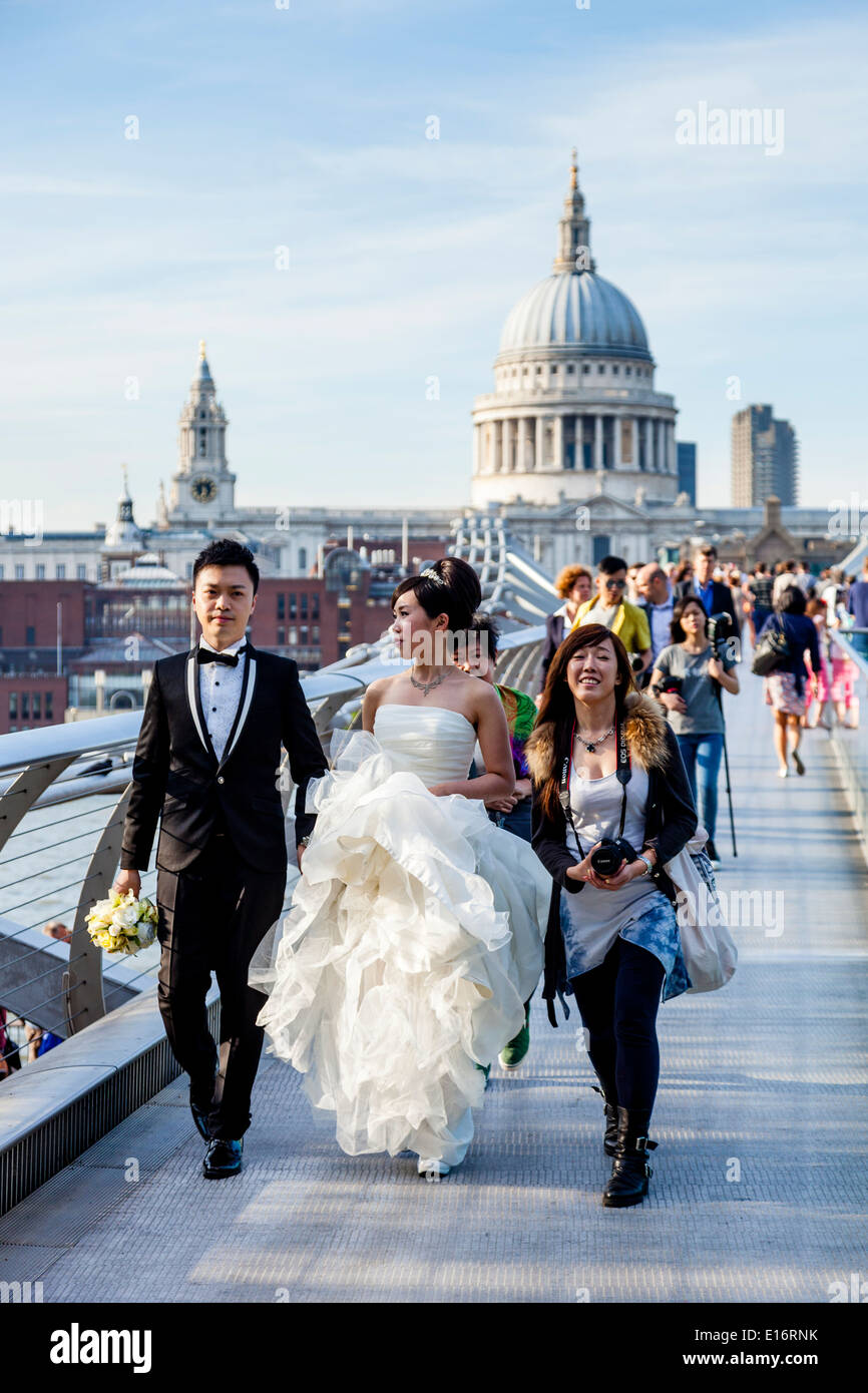 A Wedding Party From Hong Kong Crossing The Millennium Bridge