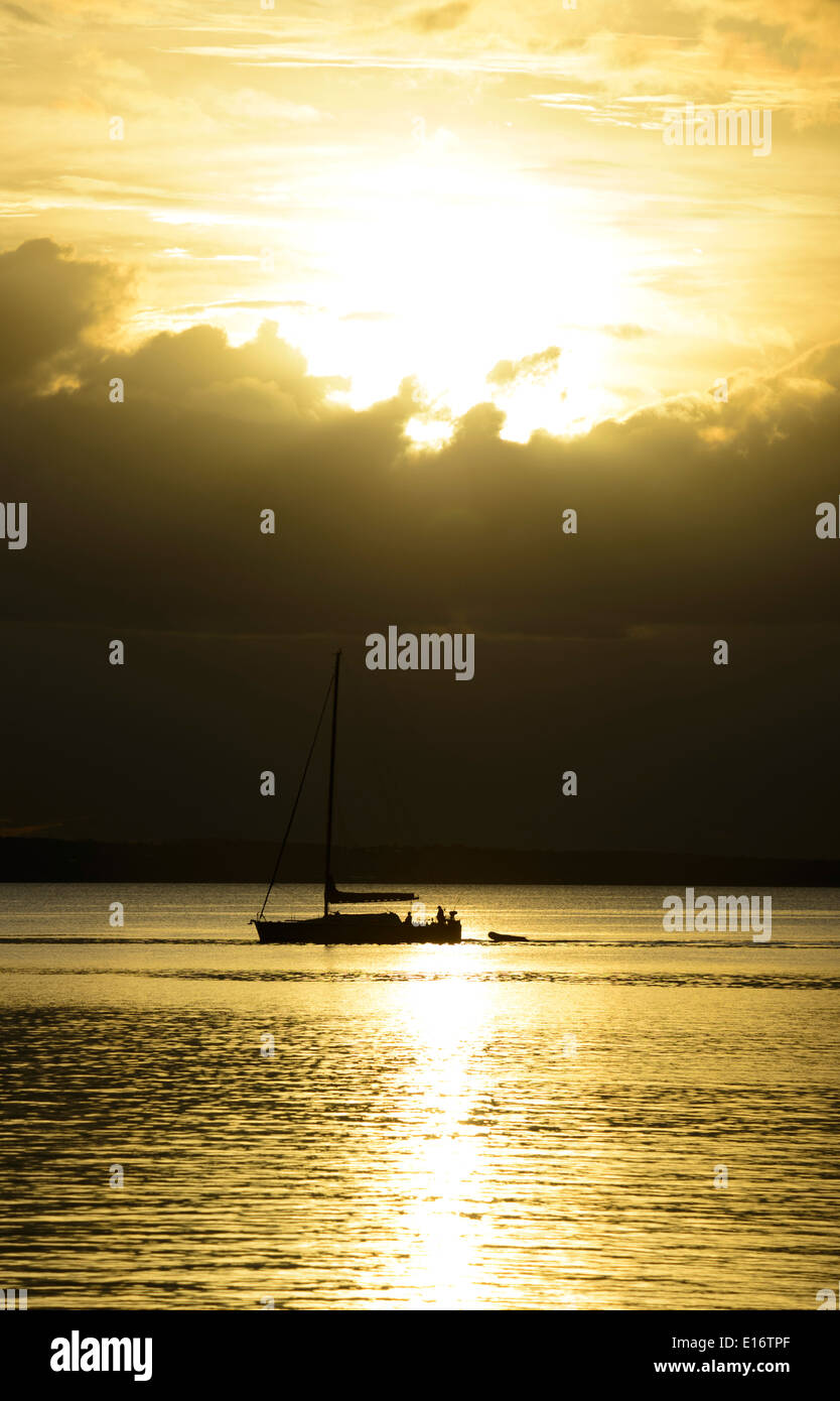 Sailing Boat silhouetted at Sunset, Fraser Island, Queensland, QLD, Australia Stock Photo