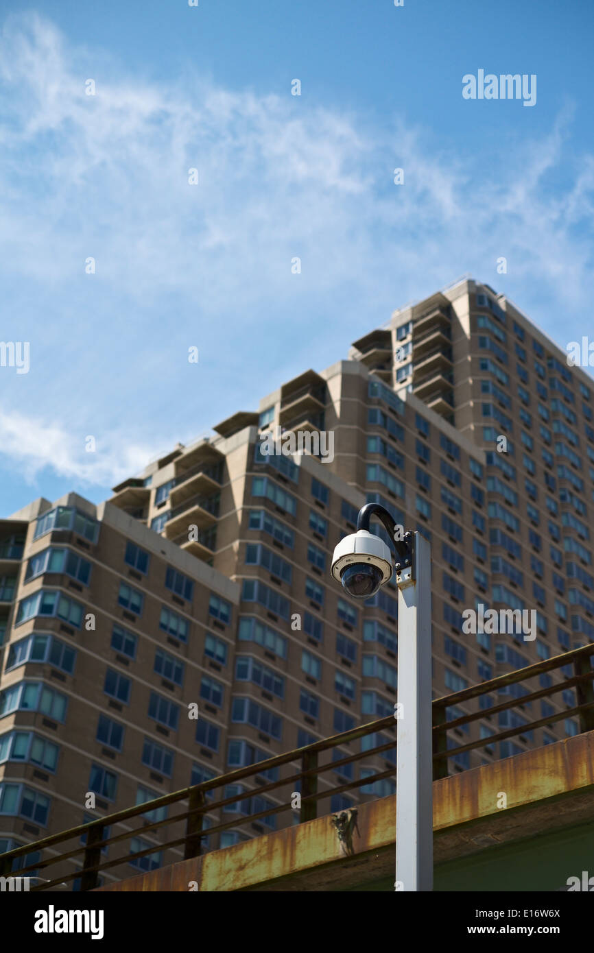 Security camera, highway overpass and apartment building on New York City's East Side Stock Photo