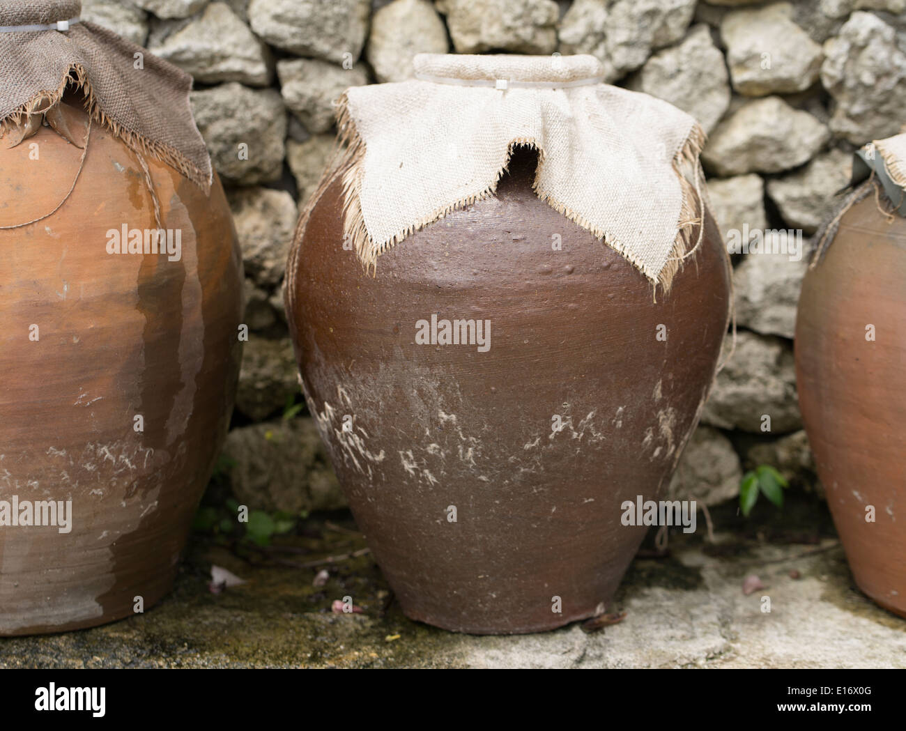 Earthenware jars used to store Awamori, Okinawan alcohol. Stock Photo