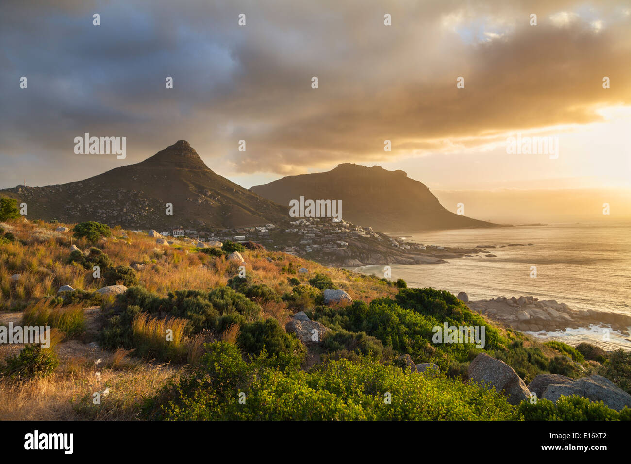 Panoramic view from Victoria Road over Llandudno and Sandy Bay at sunset, Cape Peninsula Stock Photo