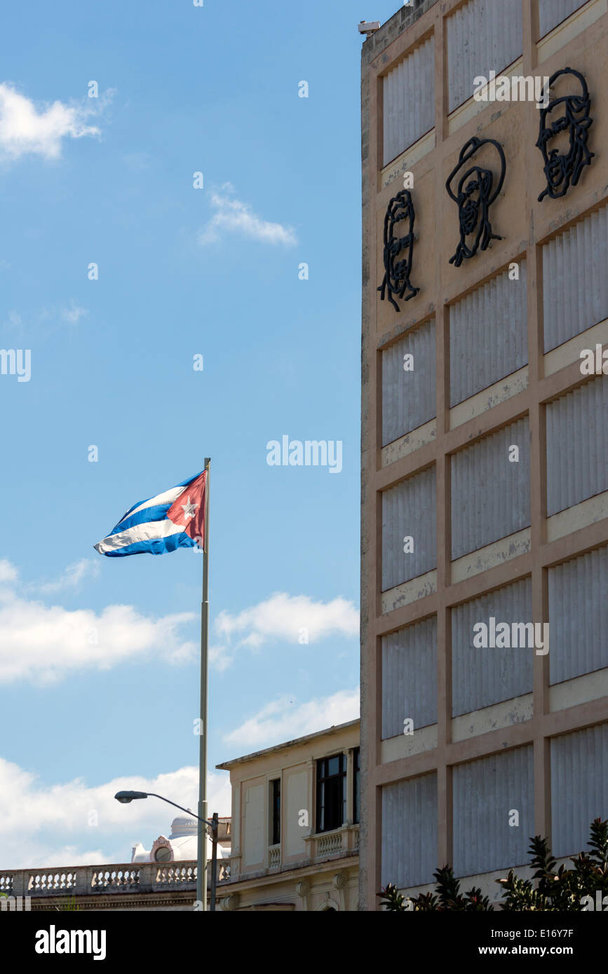 Cuban flag and pictures of political leaders in a street of havana Stock Photo