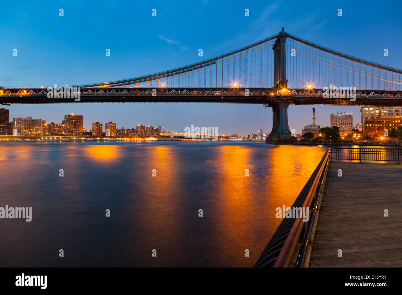 The Manhattan Bridge and skyline in New York City at night Stock Photo ...