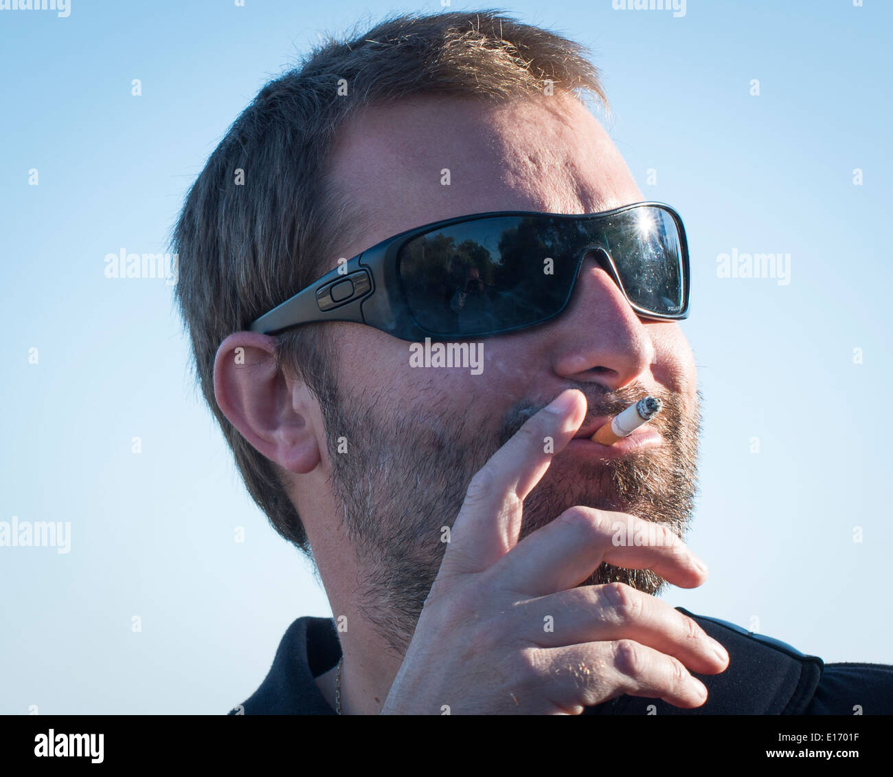 Man smoking cigarette, France Stock Photo