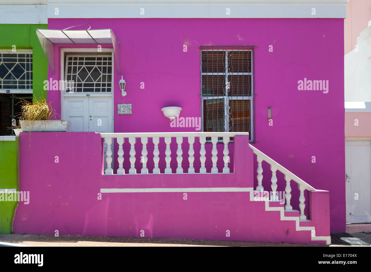 Colorful pink house in Chiappini street in the Bo Kaap district, Cape