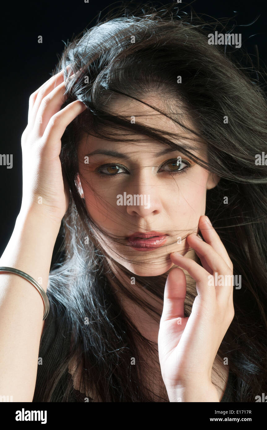 Beautiful young woman hands touching face Stock Photo - Alamy