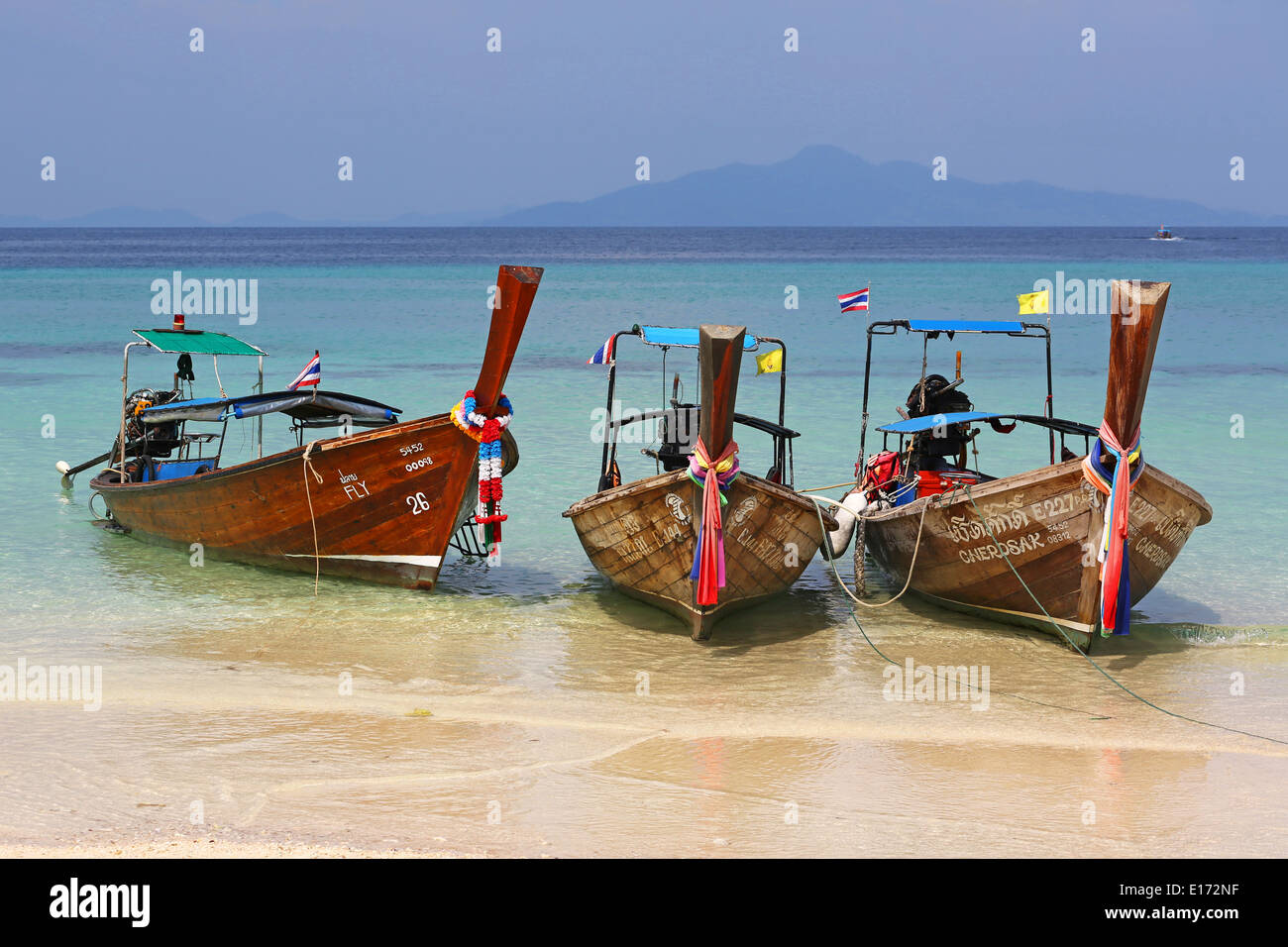 Traditional Thai long tailed boats, aka Rua Hang Yao, on Ko Phi Phi Don island beach, Andaman Sea, Thailand Stock Photo