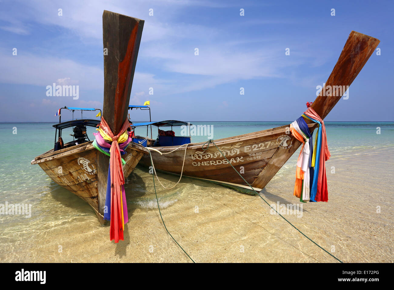 Traditional Thai long tailed boats, aka Rua Hang Yao, on Ko Phi Phi Don island beach, Andaman Sea, Thailand Stock Photo