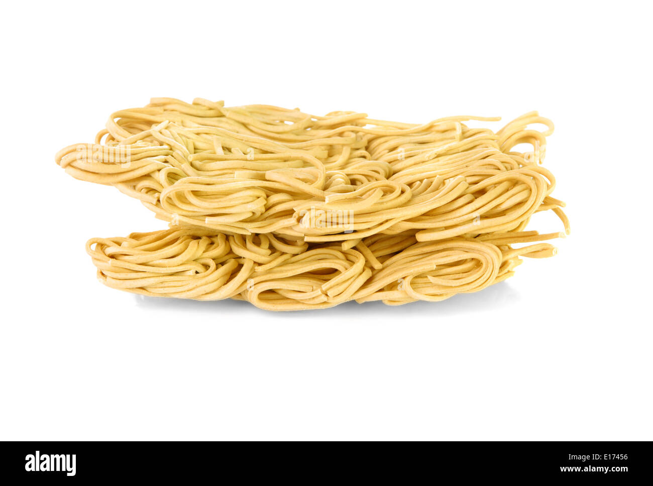 Dry egg noodles over a white background Stock Photo Alamy