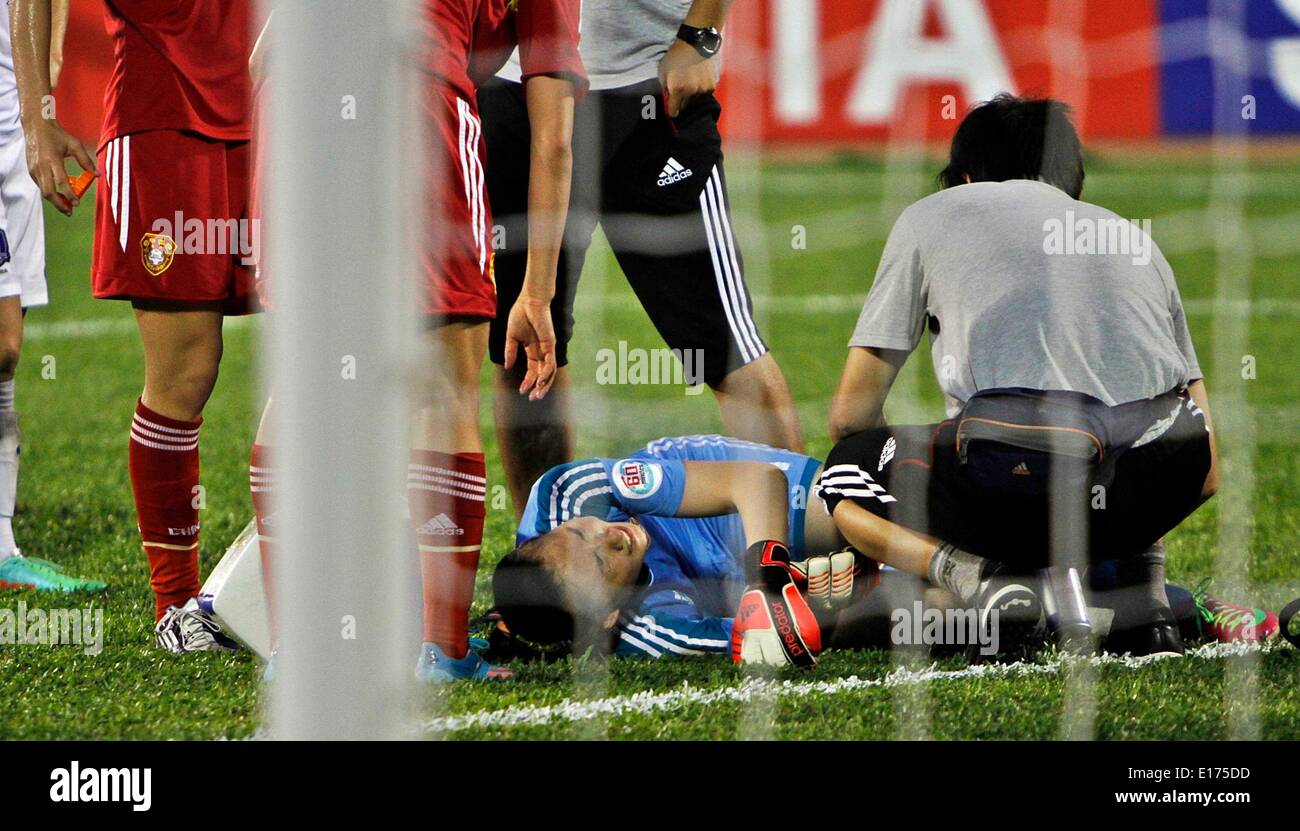 (140525) -- HO CHI MINH CITY, May 25, 2014 (Xinhua) -- Zhang Yue of China gets injured during the third-place match of 2014 Asian Football Confederation (AFC) Women's Asian Cup at Thong Nhat Stadium in Ho Chi Minh City, Vietnam, May 25, 2014. China defeat South Korea 2-1 to win the third place of the event. (Xinhua/Nguyen Le Huyen) Stock Photo