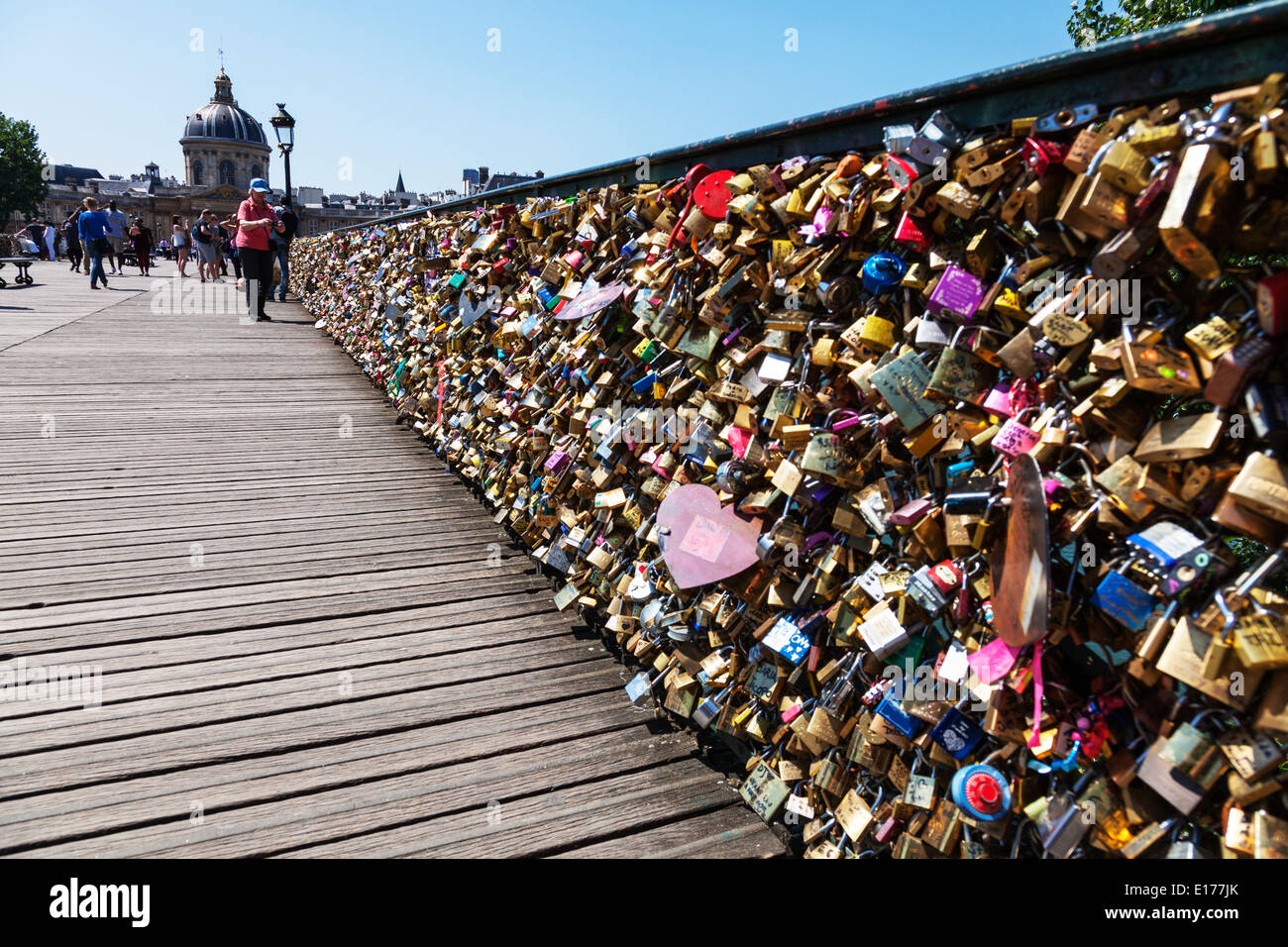 wooden Pont des Arts in Paris Love locks wish locks left as mementos by tourist a large number of Love padlocks adorn weight Stock Photo