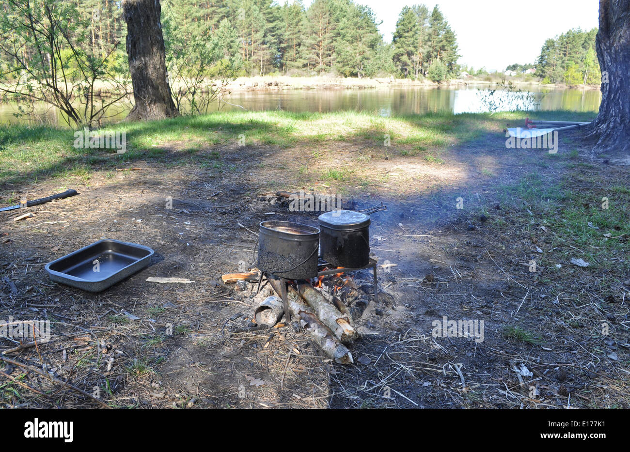 National Park 'Meshchera', Ryazan region, Russian Federation. Cooking on camp fire. Stock Photo