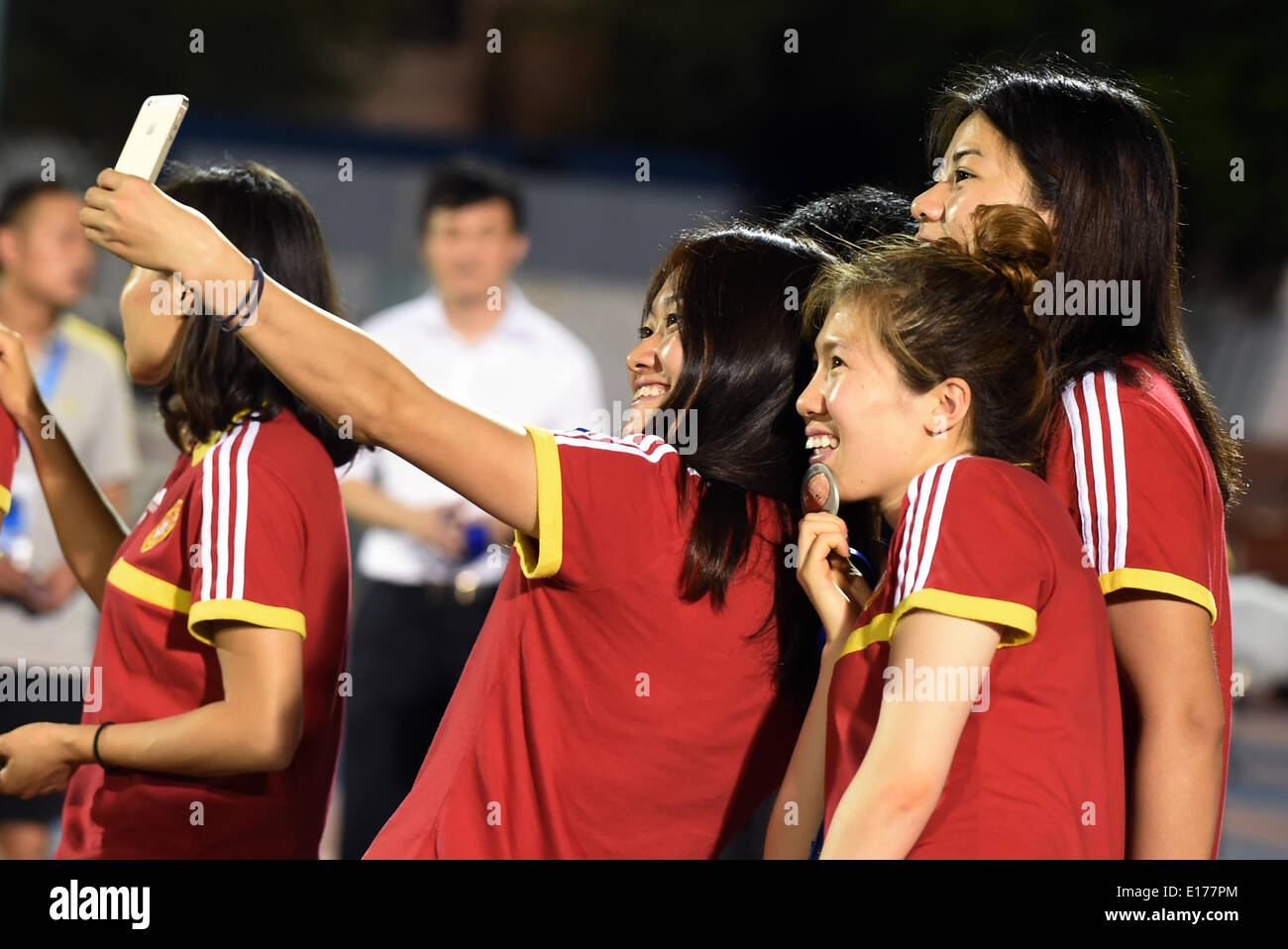 Ho Chi Minh City, Vietnam. 25th May, 2014. Team China celebrate on the podium during the award ceremony at the 2014 Asian Football Confederation (AFC) Women's Asian Cup at Thong Nhat Stadium in Ho Chi Minh City, Vietnam, May 25, 2014. China defeat South Korea 2-1 to win the third place of the event. © Cheong Kam Ka/Xinhua/Alamy Live News Stock Photo
