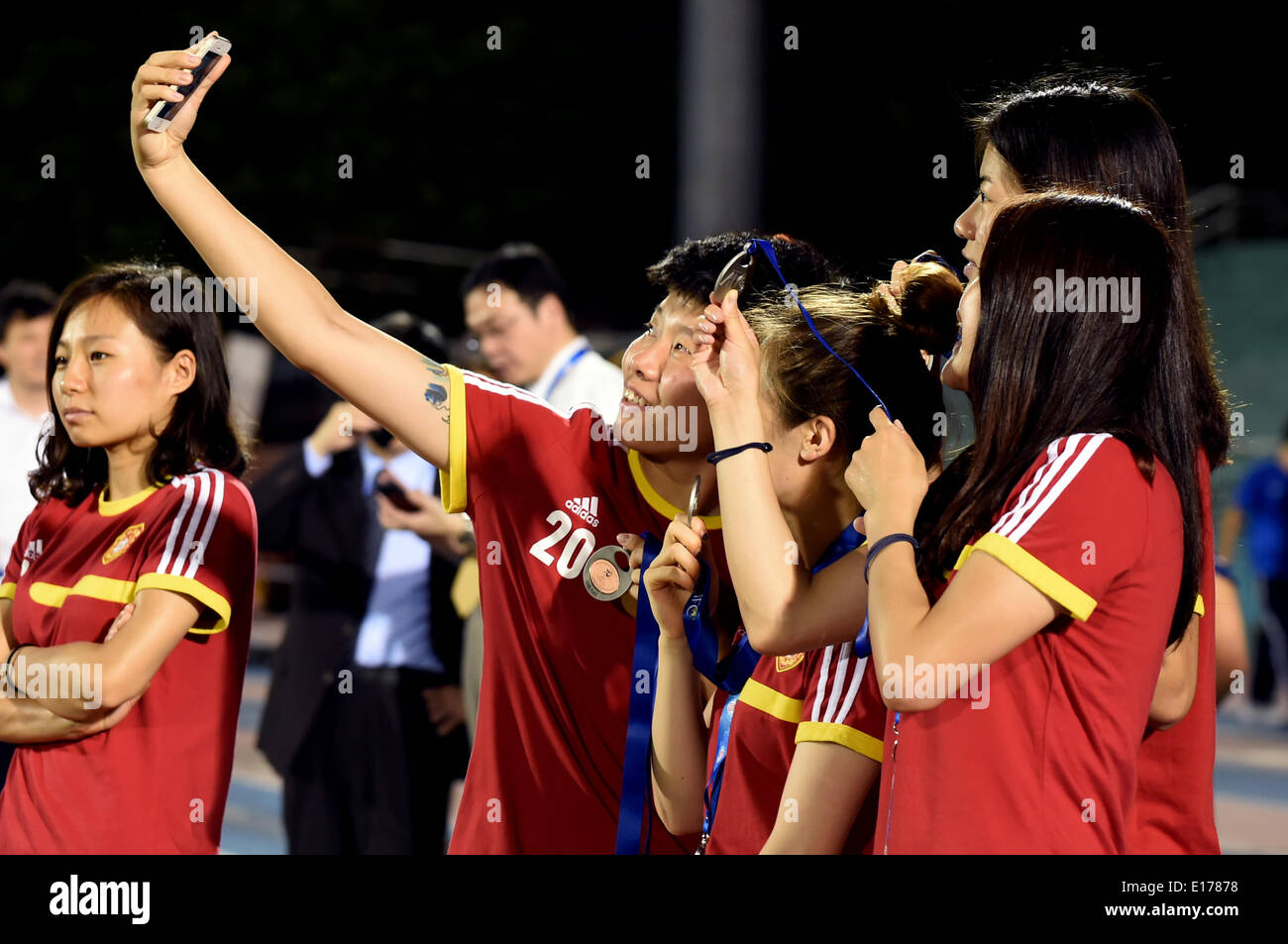 Ho Chi Minh City, Vietnam. 25th May, 2014. Team China celebrate during the award ceremony at the 2014 Asian Football Confederation (AFC) Women's Asian Cup at Thong Nhat Stadium in Ho Chi Minh City, Vietnam, May 25, 2014. China defeat South Korea 2-1 to win the third place of the event. © Cheong Kam Ka/Xinhua/Alamy Live News Stock Photo