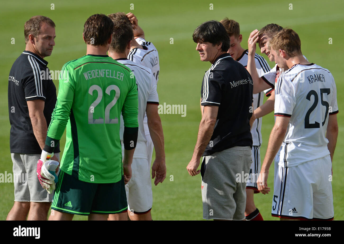 Passeier, Italy. 25th May, 2014. Assistant coach Hansi Flick (L) and head coach Joachim Loew (4- R) of the German national soccer team talk to the players Goalkeeper Roman Weidenfeller (2-L) and Christoph Kramer (R) during a break of a friendly match against the German U20 team on a training ground at St. Leonhard in Passeier, Italy, 25 May 2014. Germany's national soccer squad prepares for the upcoming FIFA World Cup 2014 in Brazil at a training camp in South Tyrol until 30 May 2014. Photo: Andreas Gebert/dpa/Alamy Live News Stock Photo