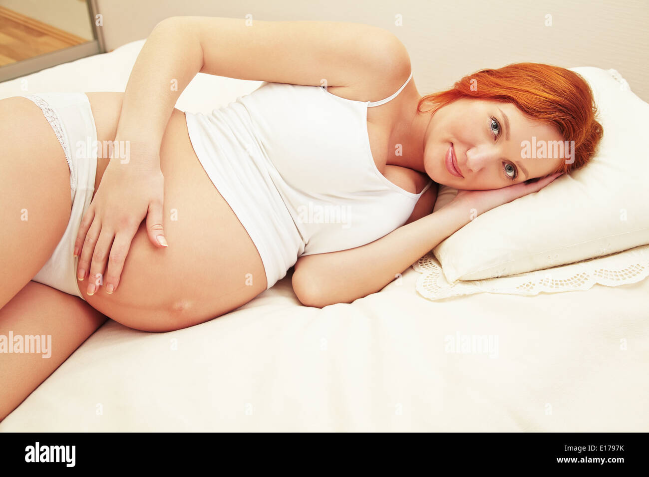 pregnant woman sleeping Stock Photo