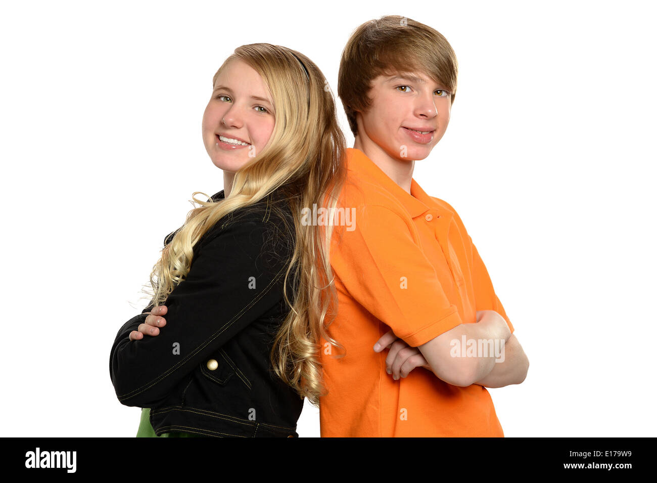 Portrait of boy and girl back to back isolated over white background ...