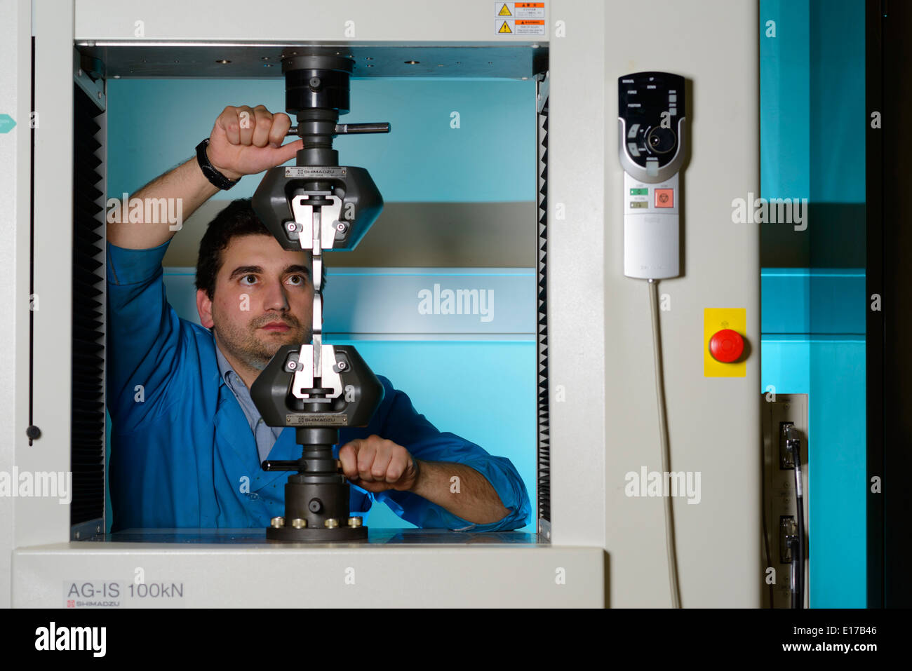 Person using a Shimadzu Autograph AG-IS 100kN universal testing instrument Stock Photo