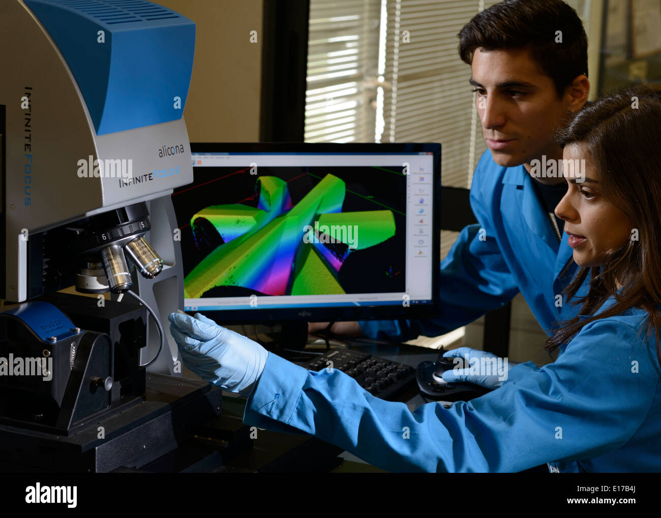 Scientists using an Alicona InfiniteFocus 3D surface measurement device Stock Photo