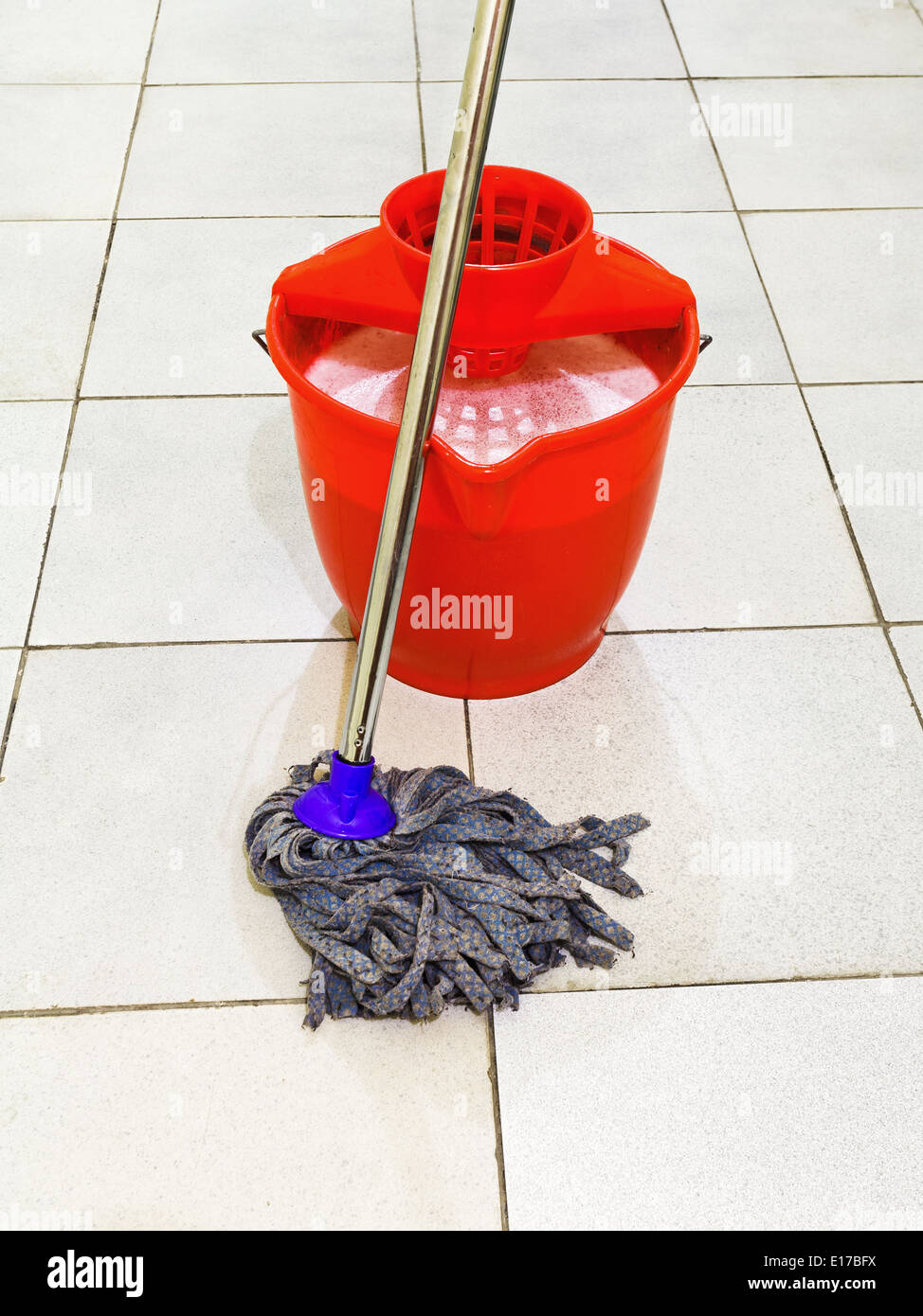 https://c8.alamy.com/comp/E17BFX/red-bucket-with-foamy-water-and-mop-the-tile-floors-E17BFX.jpg