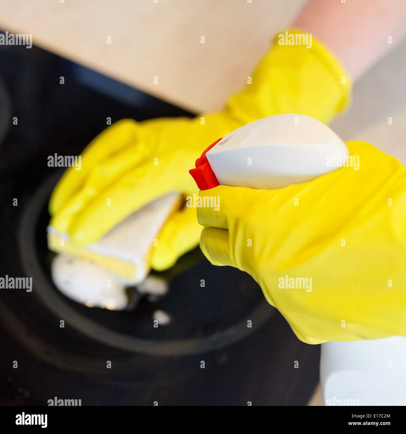 cleaning glass ceramic stove by sponge and detergent from spray bottle Stock Photo Alamy