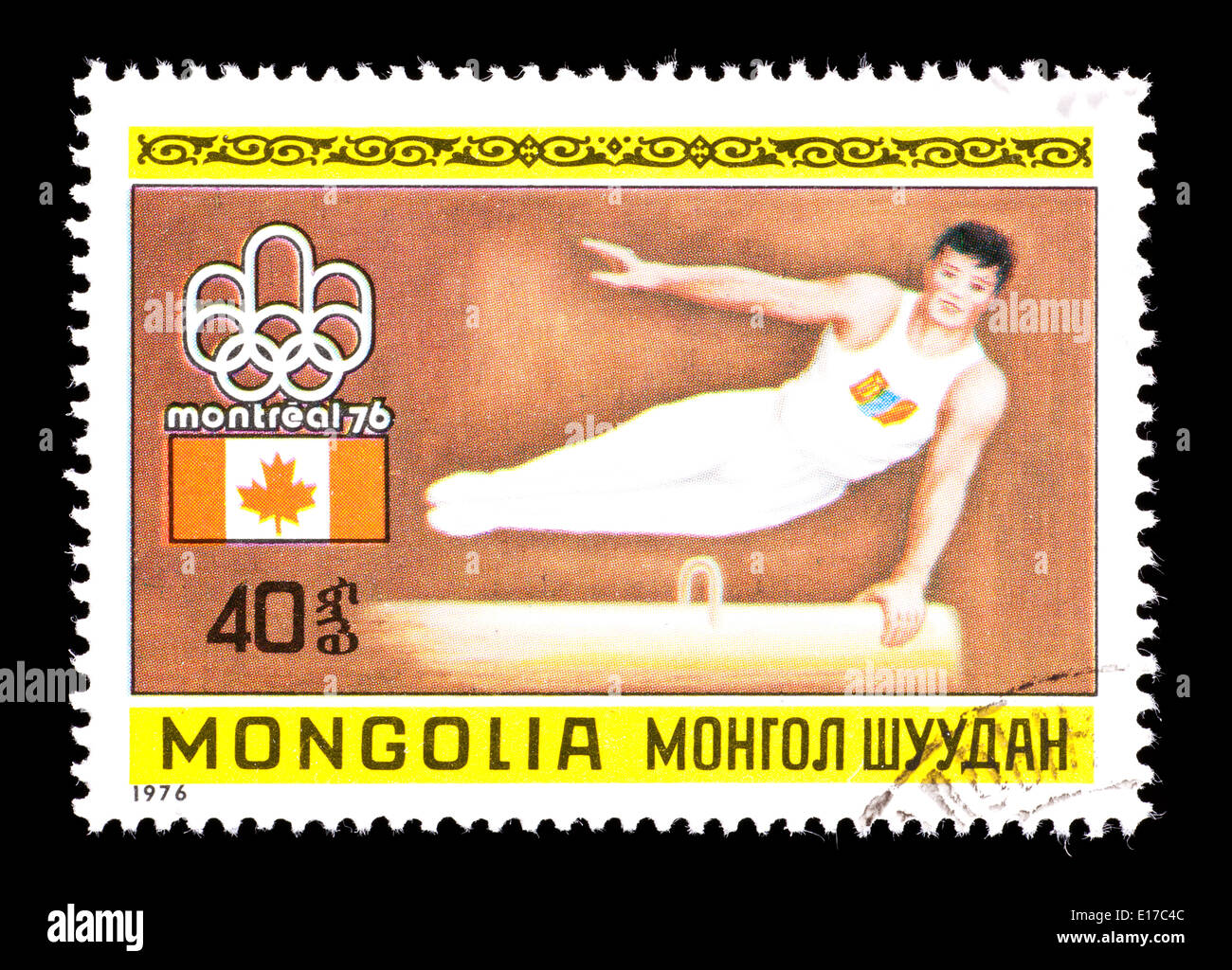 Postage stamp from Mongolia depicting a male gymnast on the pommel horse, issued for the 1976 Olympic Games in Montreal, Canada. Stock Photo