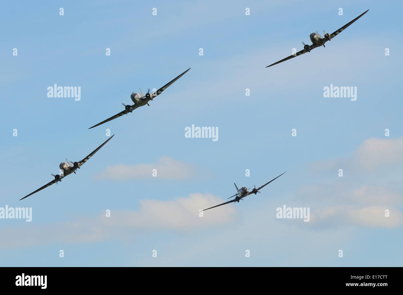 Four DC-3 C-47 Dakotas in period camouflage markings - including D Day 'invasion stripes' - flew together in the skies above Europe for the first time in many, many years Stock Photo
