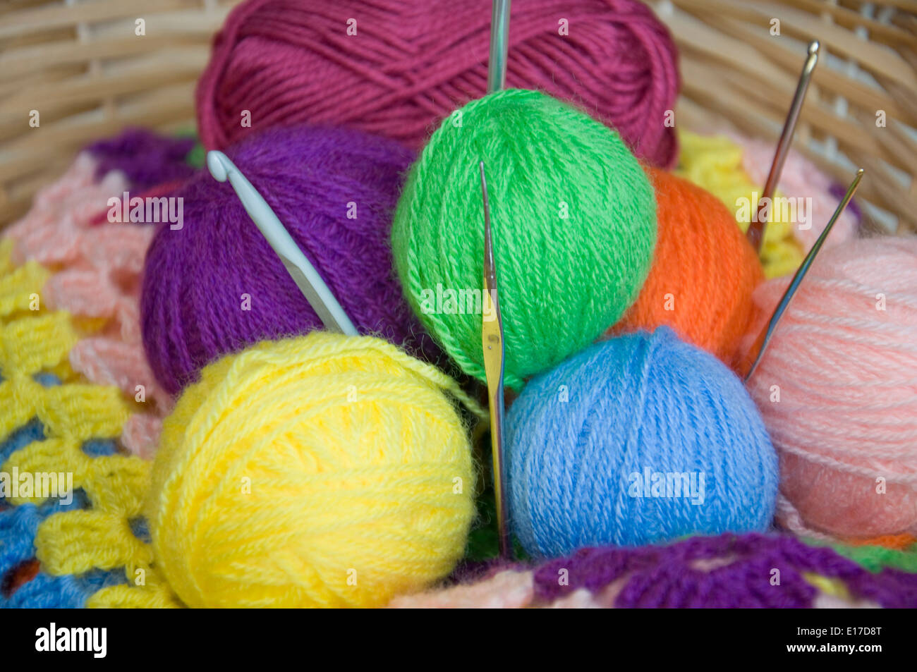 Wool yarns and crochet hooks Stock Photo