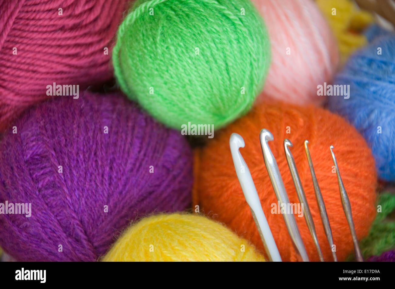 Wool yarns and crochet hooks Stock Photo