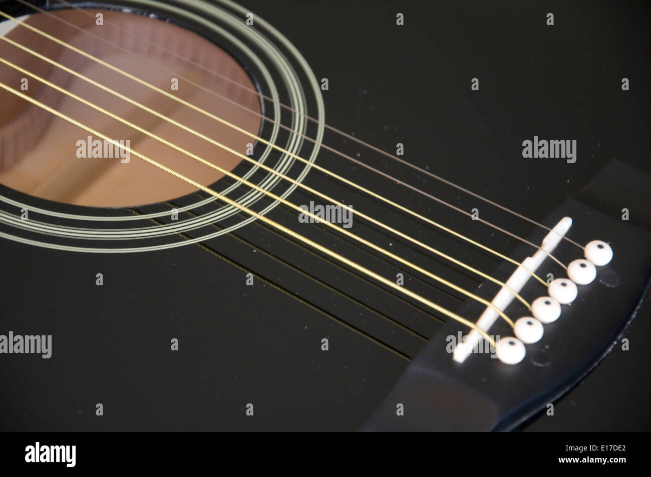 A close shot of a guitar sound hole Stock Photo