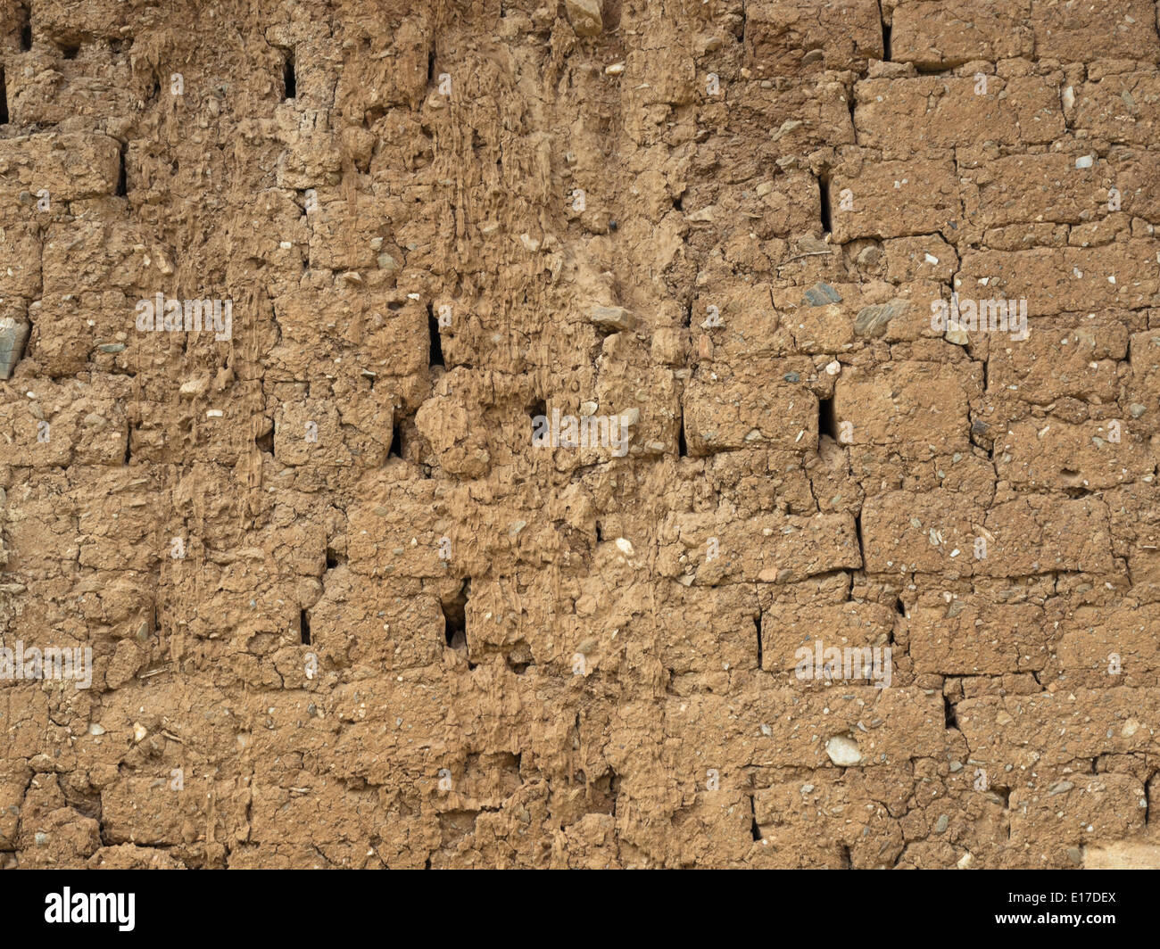 Old brick wall with tiny stones background Stock Photo
