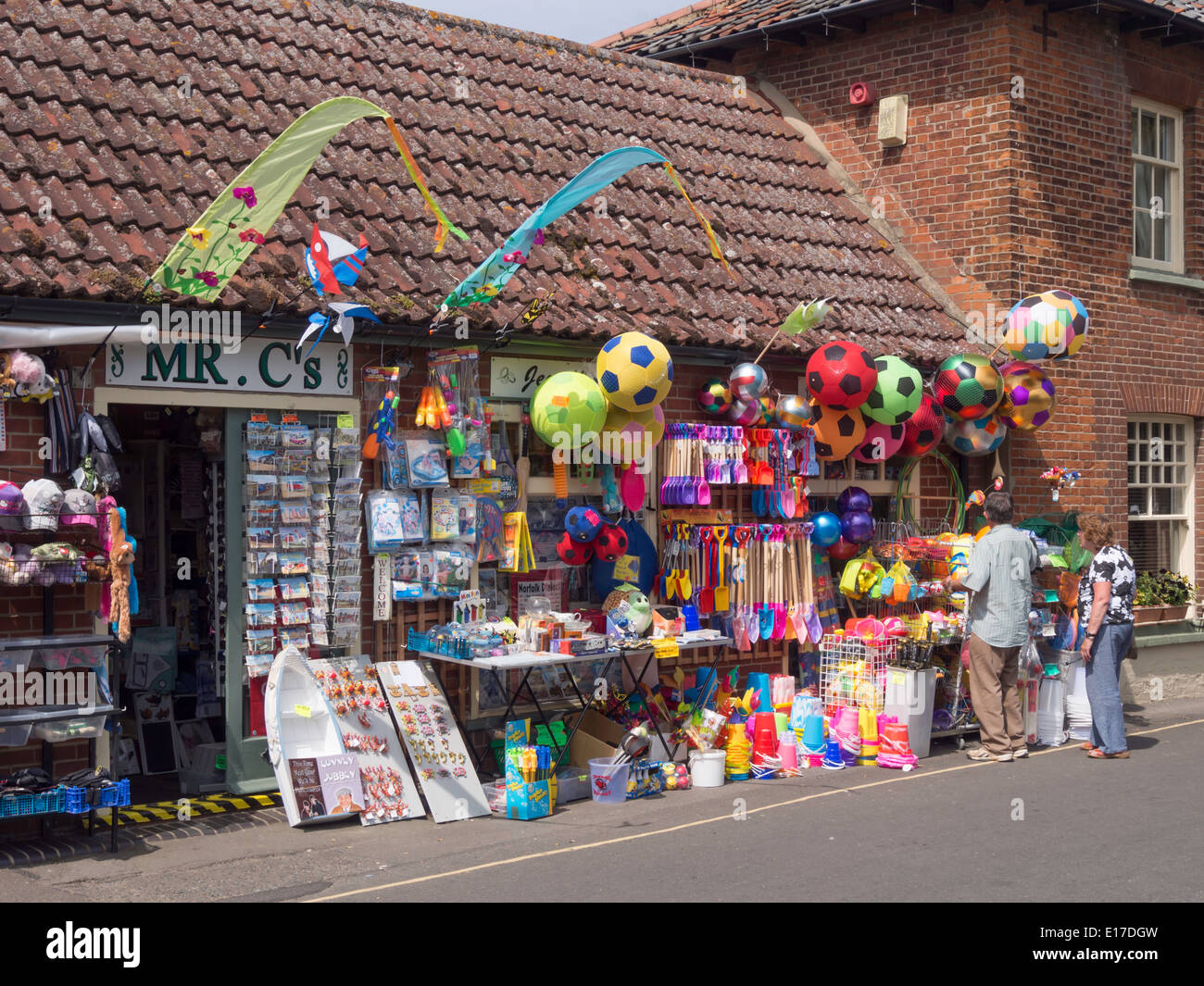 A shop selling colourful seaside beach toys in Wells next the Sea Norfolk England Stock Photo