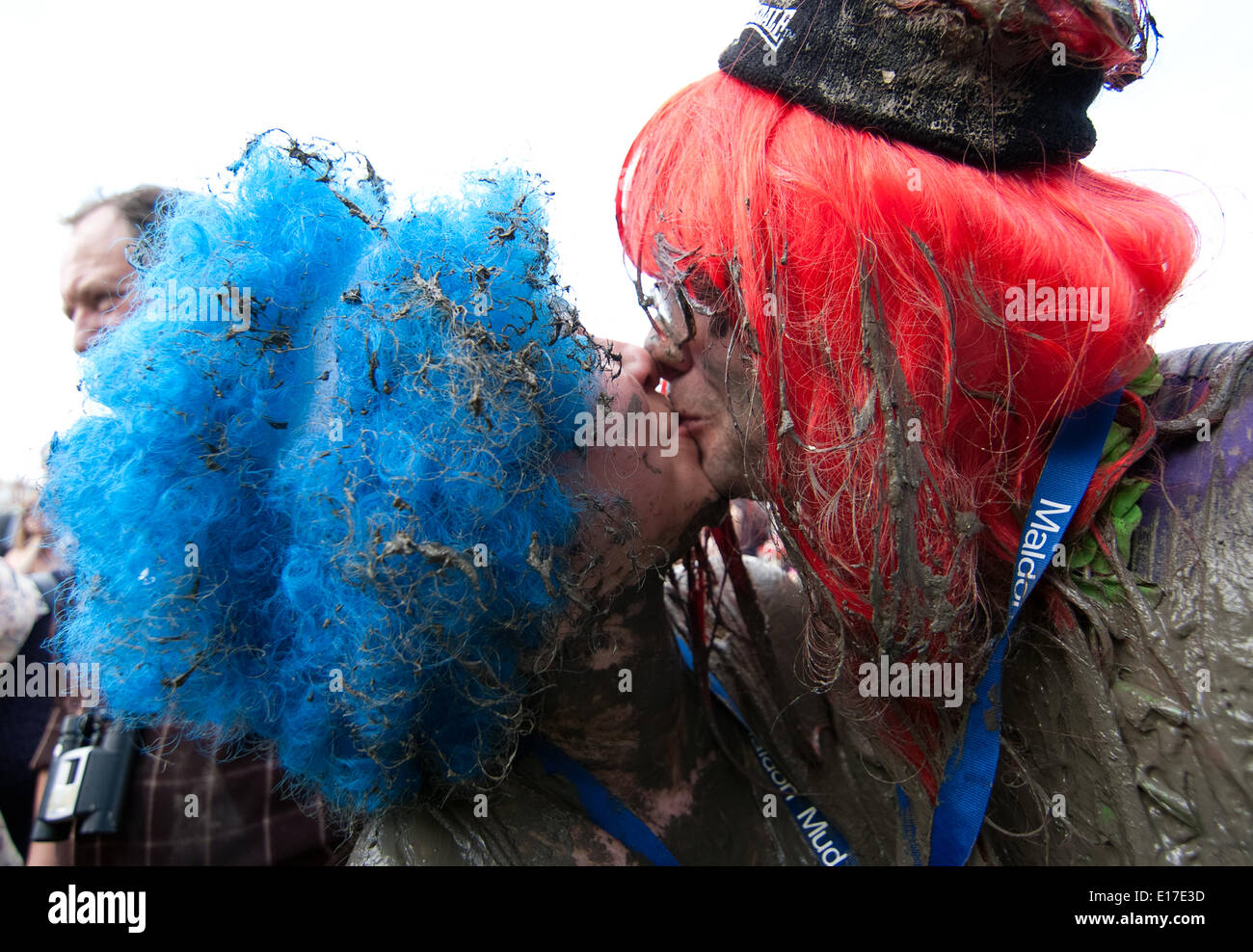 Maldon, UK, 25th May, 2014. A loving couple share a kiss at the finish line of the 2014 Maldon Mud Race essex. Credit:  Tony Worpole/Alamy Live News Stock Photo