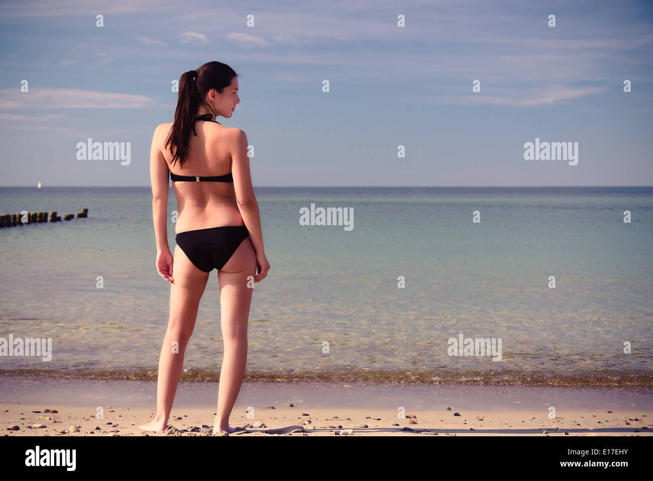 Showing off her bikini body. a beautiful young woman at the beach Stock  Photo - Alamy