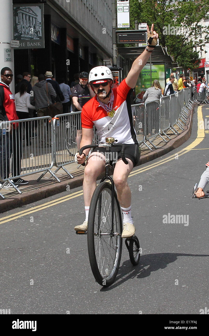 Nottingham, UK. 25th May, 2014. Cuthbert Clott rides his 'Penny farthing&quot; in the Family Race during Race Day of The 2014 Milk Race. Credit:  Action Plus Sports/Alamy Live News Stock Photo
